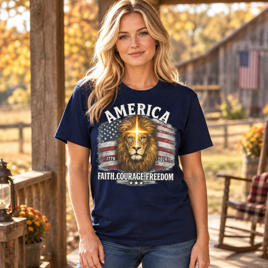 Female model wearing the navy America 250 tee on a rustic autumn porch